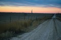 Shale Oil Rig and Pumpjack at sunset in the distance Royalty Free Stock Photo