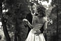 Shall we dance? - Groom leads a bride to dance in a park Royalty Free Stock Photo