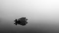 Shallop on the lake at morning fog Royalty Free Stock Photo