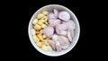 Shallot and garlic on white bowl isolated background Royalty Free Stock Photo