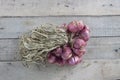 A whole shallot on brown wooden table background.