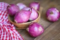 Shallots or red onion, purple shallots on basket , fresh shallot for medicinal products or herbs and spices Thai food made from