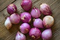 Shallots or red onion, purple shallots on wooden background , fresh shallot for medicinal products or herbs and spices Thai food