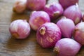 Shallots or red onion, purple shallots on wooden background , fresh shallot for medicinal products or herbs and spices Thai food