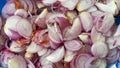 Shallots thinly sliced on a cutting board Royalty Free Stock Photo