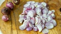 Shallots thinly sliced on a cutting board Royalty Free Stock Photo