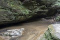 Shallow cave with stream