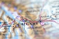 Shallow depth of field focus on geographical map location of Calgary city Canada America continent on atlas Royalty Free Stock Photo