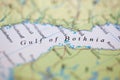 Shallow depth of field focus on geographical map location of Gulf of Bothnia off coast of Sweden on atlas Royalty Free Stock Photo