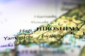 Shallow depth of field focus on geographical map location of Hiroshima city in Honshu Island Japan Asia continent on atlas Royalty Free Stock Photo