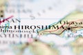 Shallow depth of field focus on geographical map location of Hiroshima Japan Asia continent on atlas Royalty Free Stock Photo