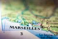 Shallow depth of field focus on geographical map location of Marseilles city France Mediterranean Europe continent on atlas Royalty Free Stock Photo