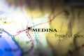 Shallow depth of field focus on geographical map location of Medina Medinah city in Saudi Arabia Asia continent on atlas Royalty Free Stock Photo