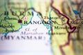 Shallow depth of field focus on geographical map location of Rangoon, Yangon city in Bruma Myanmar Indochina Asia continent on atl