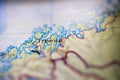 Shallow depth of field focus on geographical map location of Tromso city Norway Scandinavia Europe continent on atlas Royalty Free Stock Photo