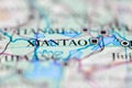 Shallow depth of field focus on geographical map location of Xiantao city China Asia continent on atlas