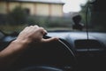 Shallow depth of field image with the hand of a driver on the steering wheel Royalty Free Stock Photo