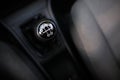 Shallow depth of field image with an old and broken gear shift knob of a manual gearbox car Royalty Free Stock Photo