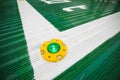 Shallow depth of field image selective focus with a green light on the floor of a hospital helipad Royalty Free Stock Photo