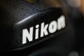 Shallow depth of field and macro image with the Nikon logo on a professional DSLR camera