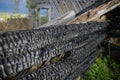 Shallow depth of field selective focus details with burned wood from a burnt house Royalty Free Stock Photo