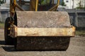 Shallow depth of field selective focus details with a heavy vibrator roller vibratory compactor, compaction roller on the Royalty Free Stock Photo