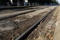 Shallow depth of field selective focus details with old, rusty and worn out tram rails on the streets of Bucharest Royalty Free Stock Photo