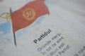 Shallow depth of field selective focus details with a Romanian Communist Party flag and nationalistic poem in an old children`s