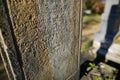 Shallow depth of field selective focus details with the text in old german language and fonts on a tomb