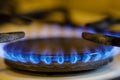 Shallow depth of field selective focus image with a burning old traditional gas stove top Royalty Free Stock Photo