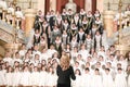 Shallow depth of field selective focus image with a choir conductor during a live concert Royalty Free Stock Photo