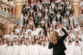 Shallow depth of field selective focus image with a choir conductor during a live concert Royalty Free Stock Photo