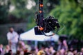 Shallow depth of field selective focus image with a professional video camera on a crane during an outdoor event Royalty Free Stock Photo