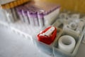 Shallow depth of field selective focus image with a red tourniquet inside a blood taking kit of a medic - blood analysis Royalty Free Stock Photo