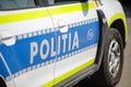 Shallow depth of field selective focus image with a Romanian Police car Royalty Free Stock Photo