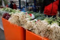 Shallow depth of field selective focus image with spring onions on sale in a vegetables street stall