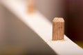 Shallow depth of field and wooden dowel in the wood