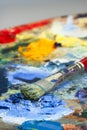 An artists paint palette and brush Royalty Free Stock Photo