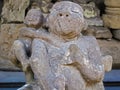 Shallow focus closeup shot of a stone statue of a child hugging an adult Royalty Free Stock Photo