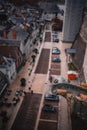 Shallow focus of a Gargoyle Sculpture with blur parking cars in the street