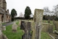 Shallow focus of a generic, cross shaped gravestone seen in a rural English church. Royalty Free Stock Photo