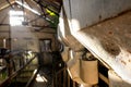 Shallow focus on a grain hopper seen in an abandoned milking parlour. Royalty Free Stock Photo