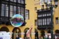 Shallow focus of a hand touching soapbubble