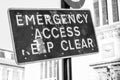 Damaged emergency access sign seen in a city centre. Royalty Free Stock Photo