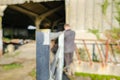 Young farmer seen working outside a cow shed on a dairy farm. Royalty Free Stock Photo