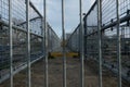 Shallow focus of locked, industrial footbridge, with detail of the fencing and non-slip footpath. Royalty Free Stock Photo