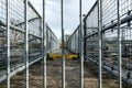 Shallow focus of locked, industrial footbridge, with detail of the fencing and non-slip footpath. Royalty Free Stock Photo