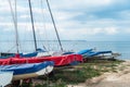 Shallow focus on moored and covered boats on the beach in Whitstable with the Isle of Sheppey on the horizon Royalty Free Stock Photo