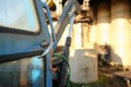 Old farm tractor seen in shallow focus in a hay shed. Royalty Free Stock Photo