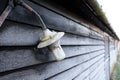 Shallow focus of an outside lamp seen on a stable door on a frosty morning. Royalty Free Stock Photo